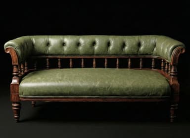 A traditional Victorian-style settee featuring dark green tufted leather upholstery and a robust dark wood frame. The design includes rolled arms, a high tufted backrest, a spindle rail detail along the lower back, and turned legs. — 3D model