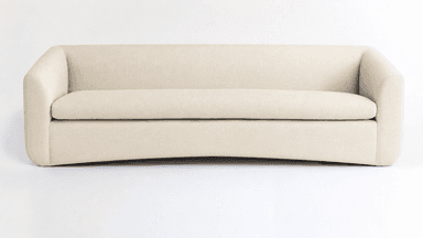 A contemporary upholstered sofa featuring a minimalist design with softly rounded armrests and a unified, clean aesthetic. The sofa is covered in a light beige, textured fabric and has a single, long seat cushion. The base is also upholstered, creating a continuous profile without visible legs, and exhibits a subtle inward curve at the bottom front. — 3D model