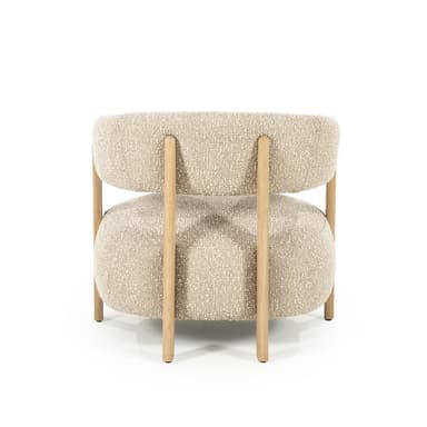 A modern armchair with a textured boucle upholstery and a wooden frame. The chair features a rounded seat and backrest, supported by four visible wooden legs and structural elements. The arms are integrated into the backrest structure. — 3D model