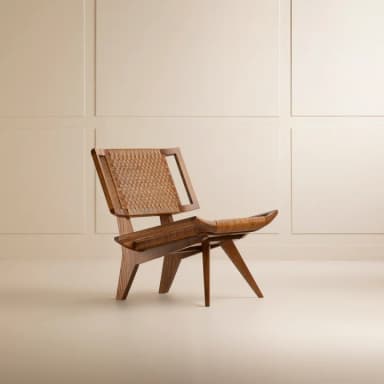 A low-profile lounge chair featuring a light-toned wooden frame and a seat and backrest crafted from woven paper cord. The design is characterized by its relaxed recline and splayed, angled legs, typical of Mid-Century Modern and Danish design aesthetics. The chair appears to be in excellent condition. — 3D model