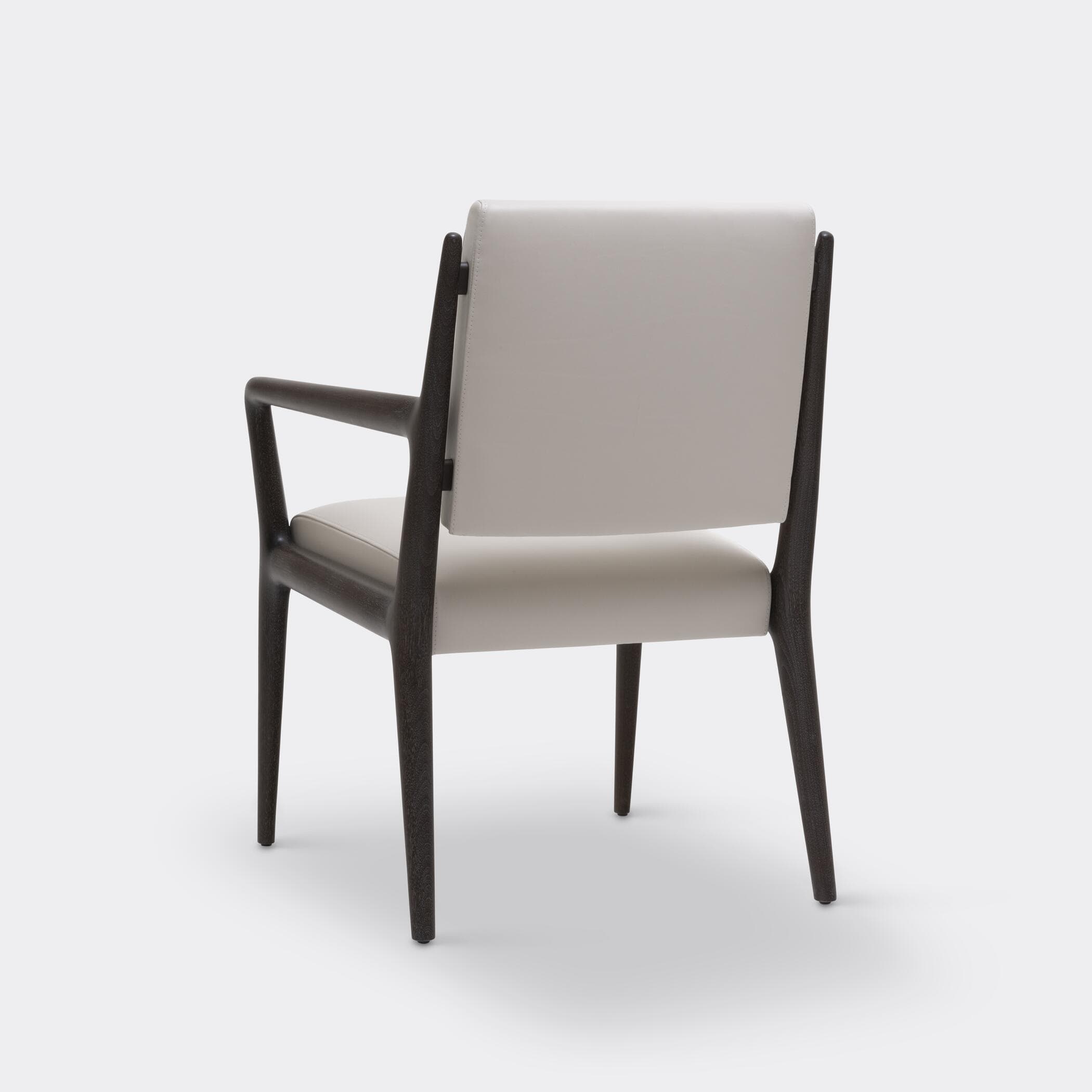 A contemporary armchair with a dark wooden frame and light-colored upholstered seat and backrest, featuring clean lines and integrated armrests. — 3D model