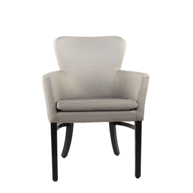 The image displays a technical drawing with dimensions of an upholstered armchair. The chair features a barrel-shaped backrest, integrated armrests, and a separate seat cushion. It is supported by four dark-finished, tapered wooden legs, with the rear legs showing a slight outward flare. The drawing includes various measurements for height, width, and depth. — 3D model