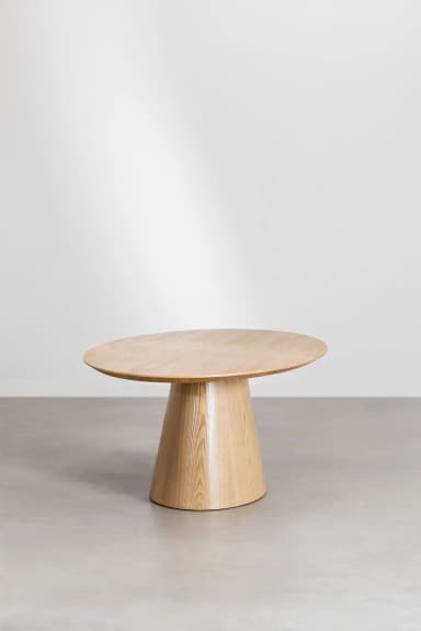 A modern round dining table featuring a light-toned wooden top and a matching conical pedestal base. The table has a minimalist design with clean lines and a smooth finish, showcasing the natural wood grain. — 3D model