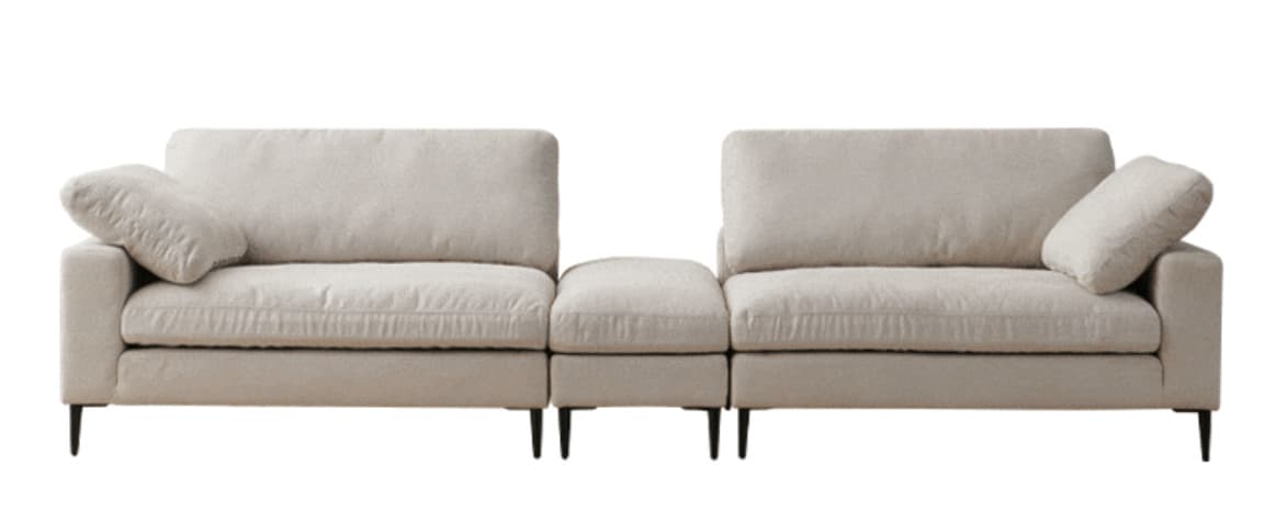 A light beige, contemporary modular sectional sofa composed of three units (two armrests and one armless) with loose back cushions and tapered black legs, set against a white background. — 3D model
