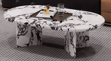 An oval-shaped coffee table with a marble-patterned top and base. The base consists of two block-like supports, one with a single vertical piece and the other with two pieces forming an asymmetrical structure. The surface features a white base with black veining, mimicking natural stone. — 3D model