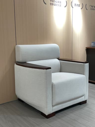 A single-seater upholstered armchair featuring a prominent dark wood exterior frame that encompasses the light-colored fabric cushions. — 3D model