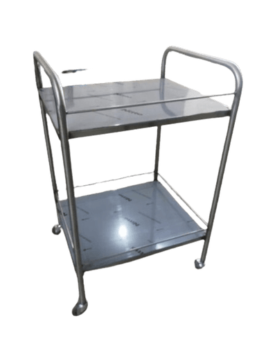 A two-tier utility cart constructed from polished stainless steel, featuring a tubular frame with integrated handles on two sides and four swivel casters for mobility. Each shelf has a raised edge to prevent items from falling off. The design is utilitarian and robust. — 3D model
