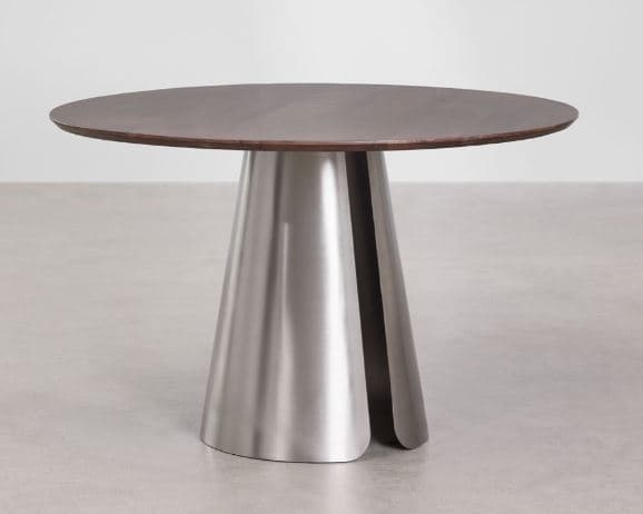 A modern round dining table featuring a dark wood top and a unique conical pedestal base made of brushed metal. The base has a split design, adding a distinctive architectural element. — 3D model