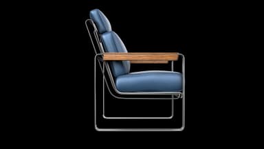 A modern lounge chair featuring a polished tubular steel frame, deep blue leather upholstered cushions for the seat, backrest, and headrest, and wooden armrest caps. — 3D model