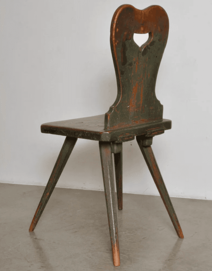 A rustic wooden chair with a distressed green painted finish, featuring a heart-shaped cutout in the backrest and splayed, tapered legs. — 3D model