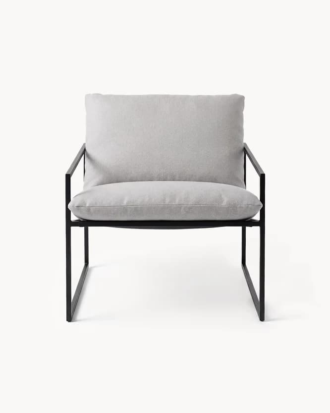 A contemporary armchair with a minimalist design. It features a thin, dark metal frame that forms the base, legs, and armrests. The seat and back are upholstered with thick, light grey cushions. — 3D model