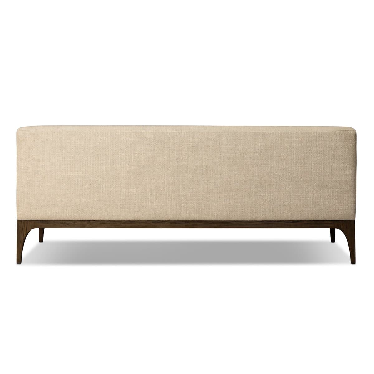 A rectangular bench with a high backrest, upholstered in a textured light beige fabric. The bench is supported by a dark wood frame and four angled legs, two visible at the front and two implied at the back. The design appears modern and minimalist. — 3D model