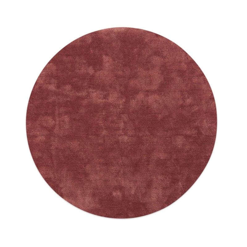 A circular rug with a short pile and a uniform, slightly textured surface. The color is a deep, muted reddish-brown. The edges appear to be cleanly finished, indicating a manufactured item. — 3D model