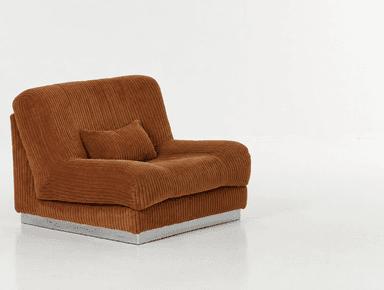 A brown, heavily upholstered lounge chair component with a ribbed corduroy fabric texture, featuring a plush, low-profile design and a slim silver-toned metal plinth base. — 3D model
