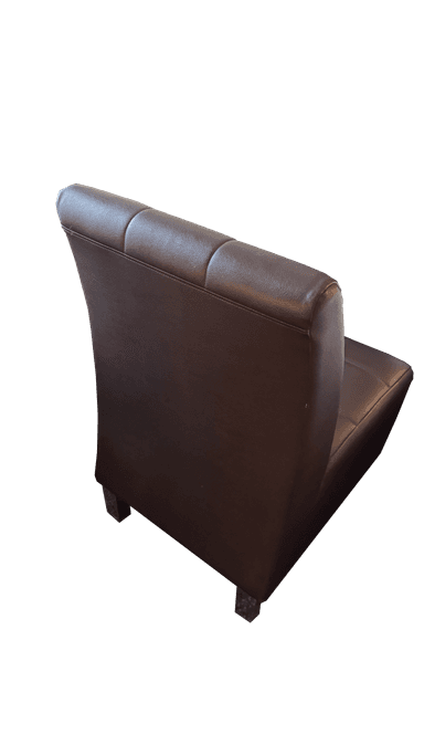 An armless chair upholstered in dark brown faux leather, featuring a distinctive square tufting pattern across both the seat and the tall, slightly curved backrest. The chair has a minimalist profile with short, concealed legs, presenting a contemporary or transitional aesthetic. — 3D model