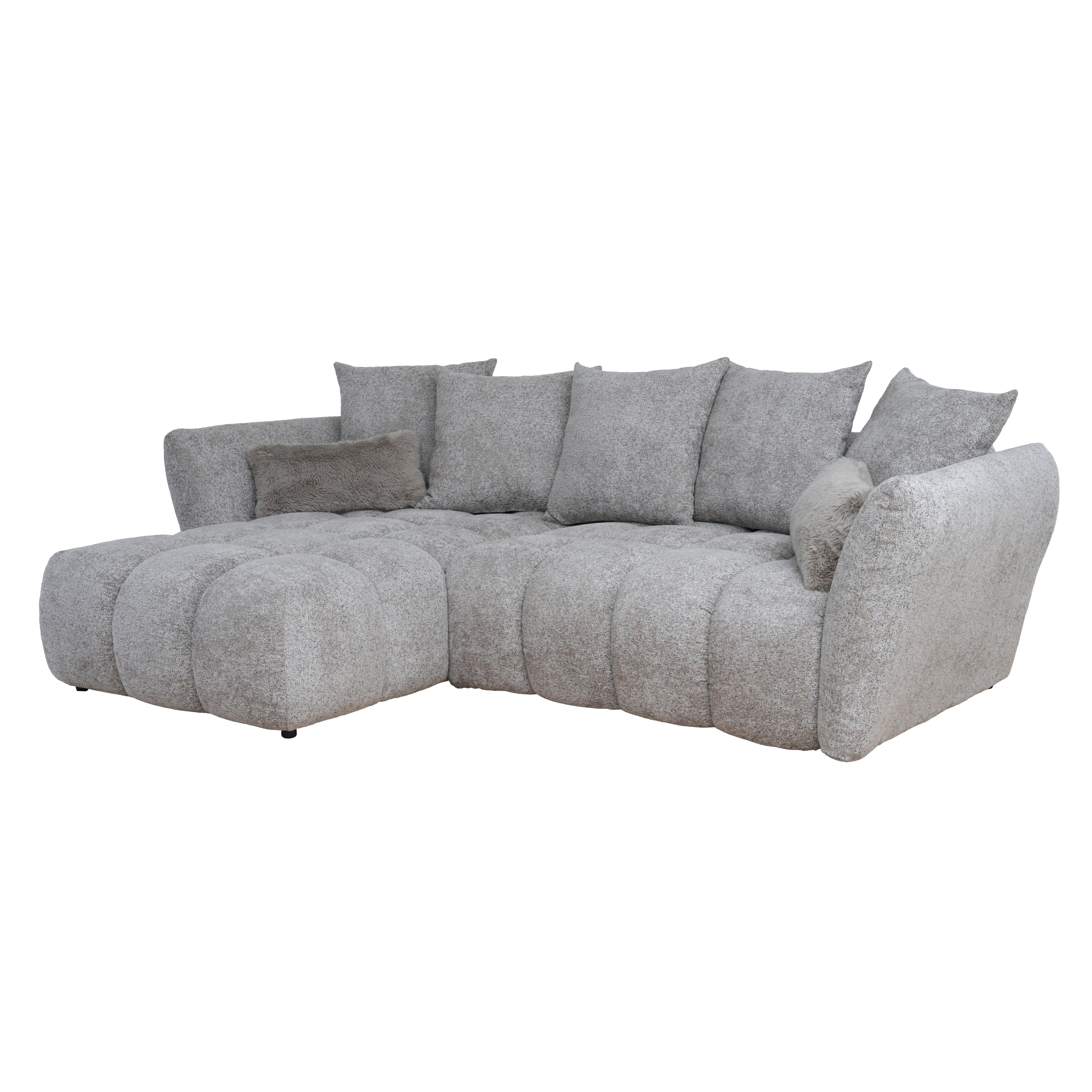 An L-shaped modern sectional sofa upholstered in a light grey, textured fabric. It features a chaise lounge on the right side from the viewer's perspective, generous seating cushions with subtle tufting or seaming, and several loose back cushions. The overall design emphasizes comfort with soft, rounded edges and a contemporary aesthetic. — 3D model