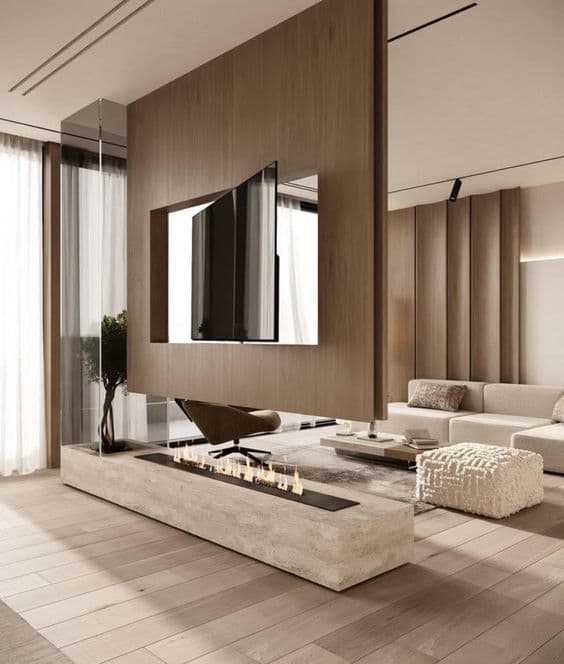A sophisticated, full-height wooden media console that acts as a room divider, featuring a recessed television screen capable of rotation and an integrated linear fireplace set into a stone base. — 3D model