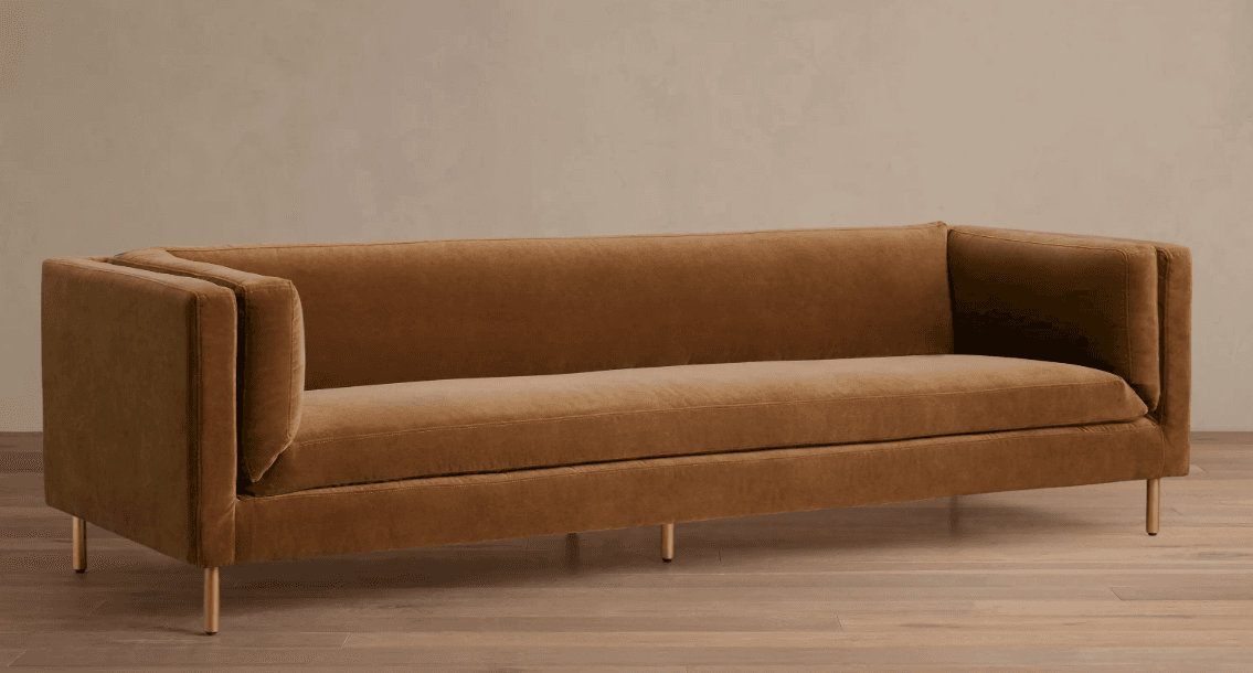 A modern, three-seater sofa with track arms and thin metal legs, upholstered in a brown velvet-like fabric. — 3D model
