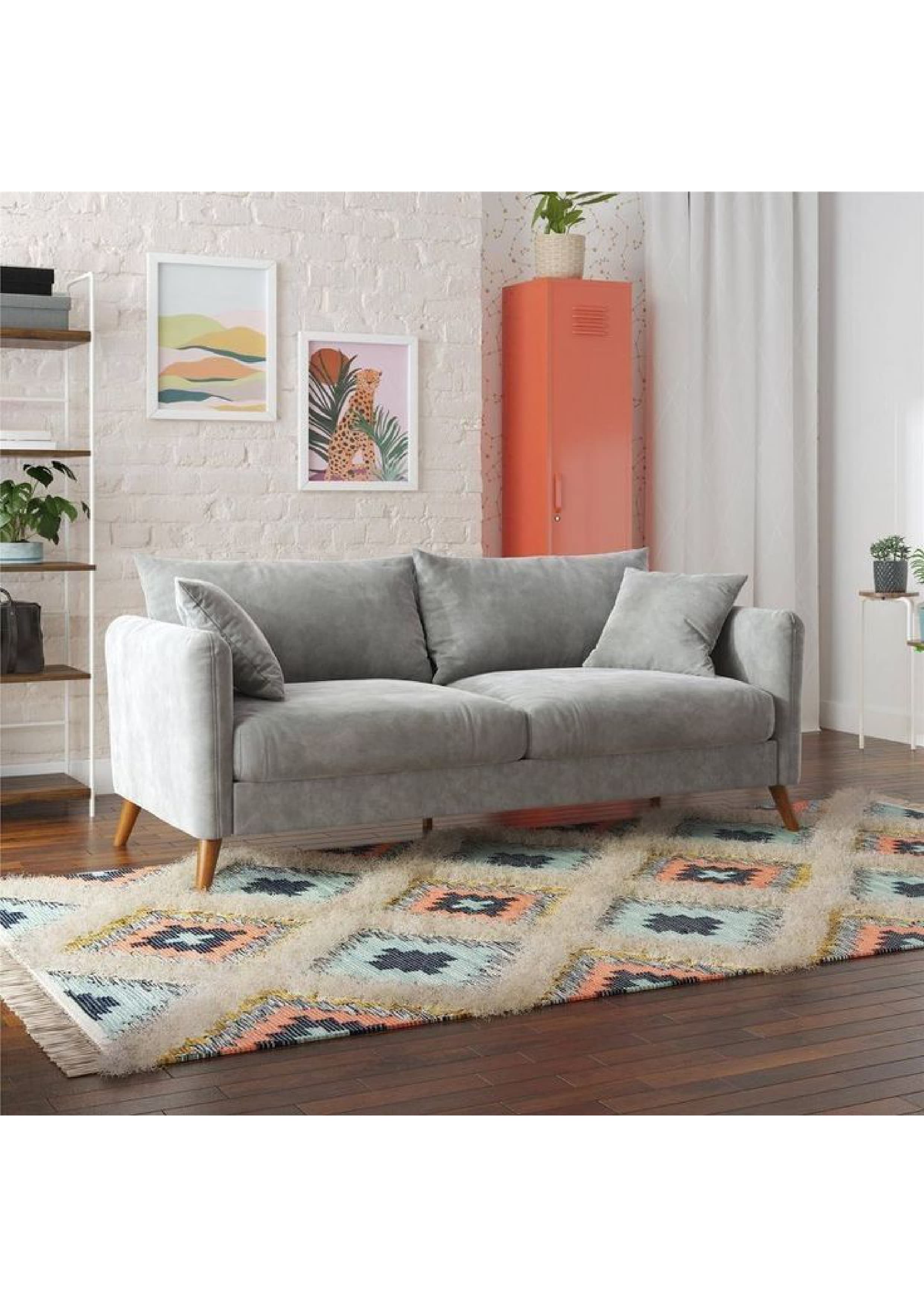 A modern two-seater loveseat, upholstered in a light grey fabric, featuring two plush seat cushions, two generous back cushions, and two smaller decorative throw pillows. It has straight, integrated arms and stands on four slender, tapered wooden legs, contributing to a contemporary and airy aesthetic. — 3D model