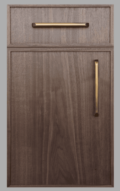 A modern dark walnut wood cabinet unit featuring a top drawer and a lower cabinet door. Both sections are equipped with sleek, cylindrical brass-finish pull handles. The wood exhibits a rich, dark brown color with a prominent grain pattern. The design is minimalist with clean lines and a framed panel aesthetic on the front surfaces. — 3D model