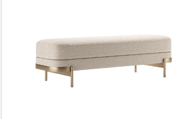 A rectangular upholstered bench with a two-tiered seating surface and slender, angled legs. The upholstery has a textured weave. The base features a horizontal band of polished metal that curves slightly downwards towards the center, connecting to thin, cylindrical legs that splay outwards. — 3D model