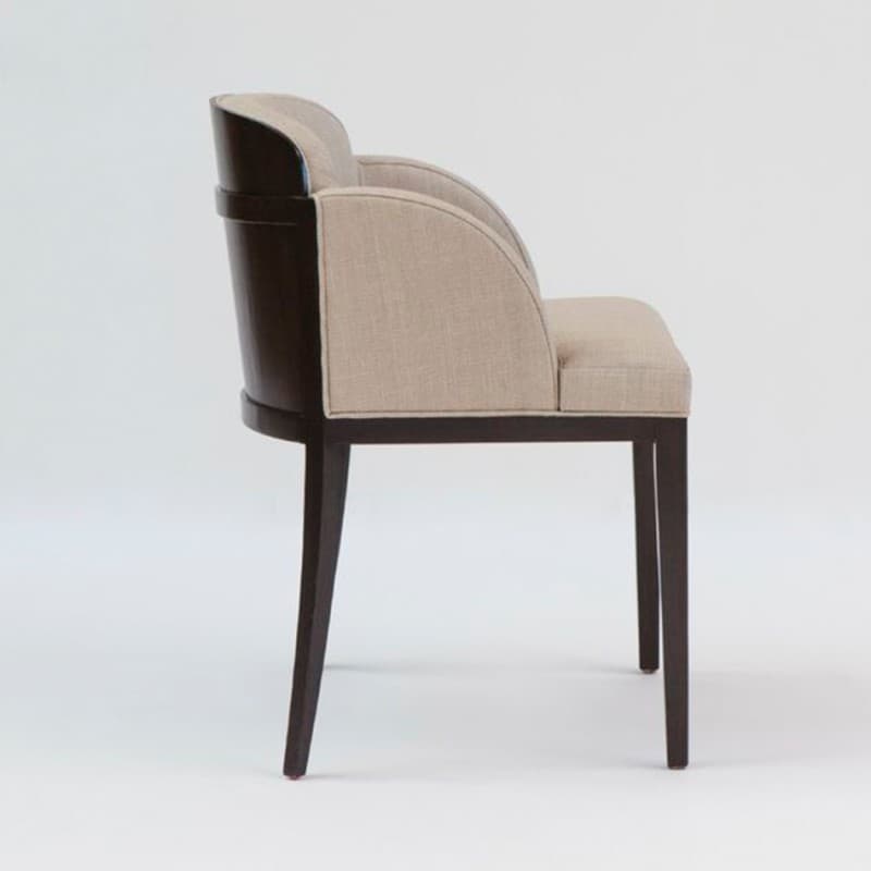 An upholstered armchair featuring a curved backrest and integrated arms, set on a dark wood frame with four legs. The upholstery is a light beige or tan fabric. — 3D model