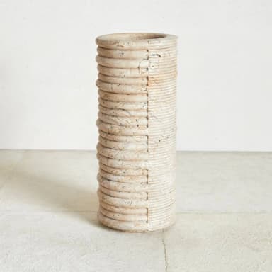 A large, cylindrical decorative vase featuring a distinctive two-tone, two-texture design. One half of the exterior is characterized by prominent, deeply grooved horizontal ribbing with a visibly distressed, aged finish, while the other half presents finer, more regular horizontal ridges with a lighter, slightly smoother appearance. The overall form is tall and narrow, suggesting use as a floor vase or large planter. — 3D model