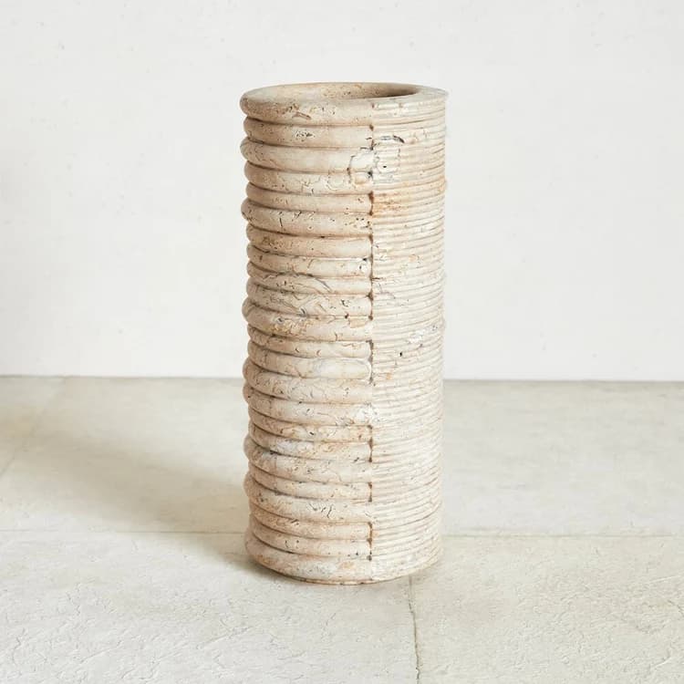 A large, cylindrical decorative vase featuring a distinctive two-tone, two-texture design. One half of the exterior is characterized by prominent, deeply grooved horizontal ribbing with a visibly distressed, aged finish, while the other half presents finer, more regular horizontal ridges with a lighter, slightly smoother appearance. The overall form is tall and narrow, suggesting use as a floor vase or large planter. — 3D model