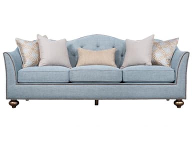 A light blue, three-cushion sofa featuring a gently curved back, rolled arms, and prominent nailhead trim detailing along the arms, base, and back. It comes with several accent pillows in complementary patterns and colors. The sofa rests on low, ornate, turned wooden legs with a metallic finish. — 3D model