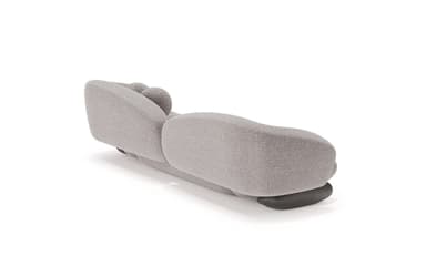 A contemporary, generously sized sofa with an organic, bulbous form. It features a low profile with rounded arms that curve inward, and a plush, textured upholstery. The seat and backrest are segmented, creating a unique visual texture. Two spherical throw pillows are integrated into the design, resting on the backrest. — 3D model
