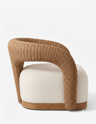 A contemporary armchair featuring a distinctive, continuous woven rattan frame that forms both the backrest and armrests. The seat consists of a thick, rounded, upholstered cushion, and the entire piece rests on a solid wooden plinth-style base. — 3D model