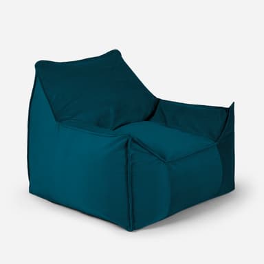 A teal-colored bean bag chair with a structured, armchair-like design. It features a high backrest, integrated armrests, and a deep seat, all upholstered in a soft, textured fabric. The chair appears to be filled with loose material, allowing it to conform to the user's body. A small red tag with white lettering is visible on the upper right side of the backrest. — 3D model