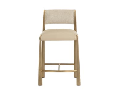 A contemporary bar stool with a metal frame and upholstered seat and backrest. The frame has a warm metallic finish and features tapered legs connected by a footrest. The seat and backrest are padded and covered in a neutral-toned fabric. — 3D model