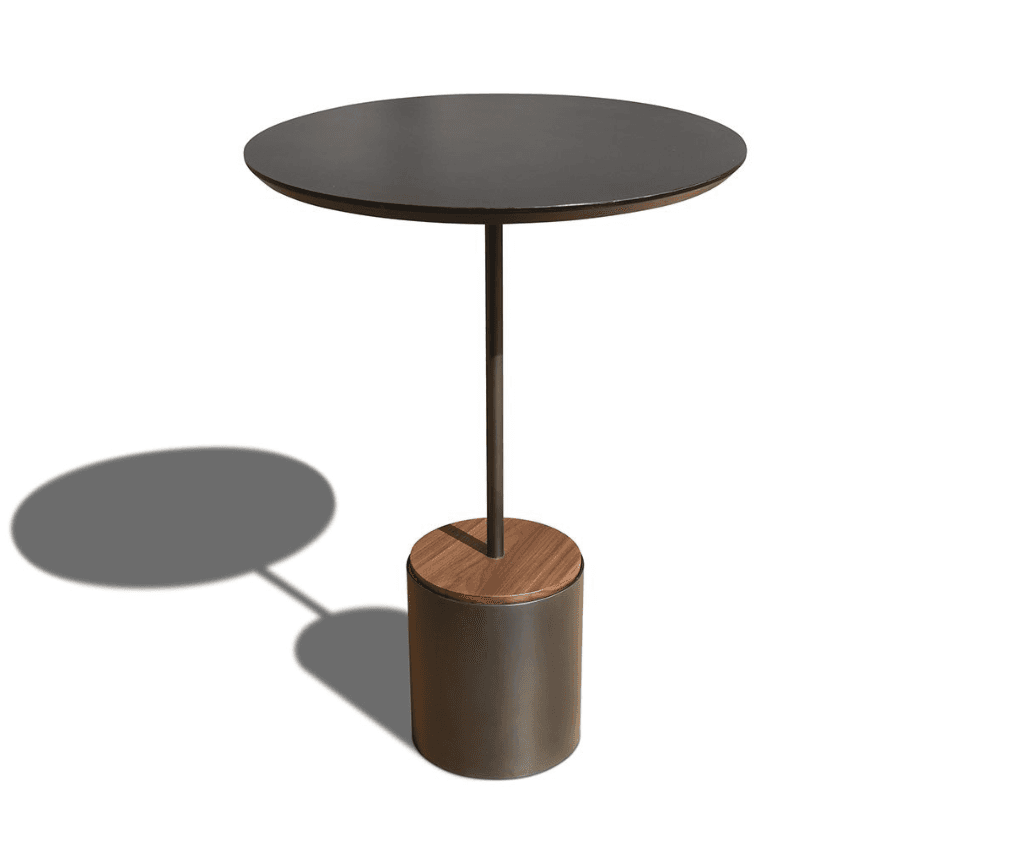 A modern side table with a round, dark-colored tabletop supported by a slender, dark metal stem. The base is cylindrical, with a dark metal outer casing and a wooden top insert. The design is minimalist and contemporary. — 3D model