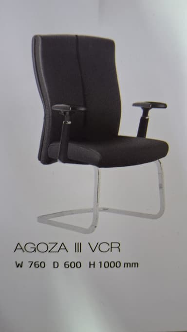 A contemporary office visitor chair featuring a high back, padded seat, and fixed loop armrests. The chair is upholstered in dark grey fabric and supported by a polished chrome-plated cantilever tubular steel frame. — 3D model