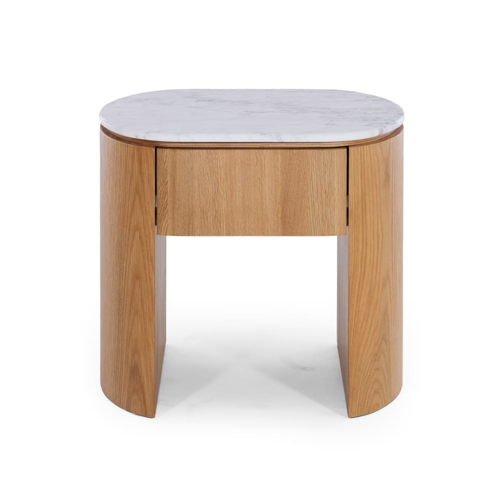 A modern and minimalist nightstand featuring a light-toned oak wood construction with a waterfall-edge design and an oval white marble top. It includes a single integrated drawer with a discreet, handleless design. The piece stands on two curved, solid wood legs that form the body of the nightstand. — 3D model