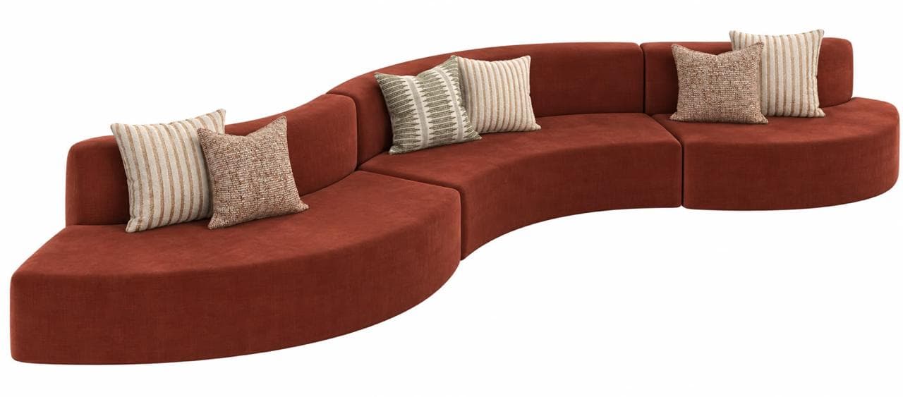A modern curved modular sectional sofa upholstered in a rich terracotta-colored fabric, presented with multiple decorative throw pillows against a plain white background. The sofa is composed of several seamlessly connected segments forming an elongated, undulating seating arrangement. — 3D model