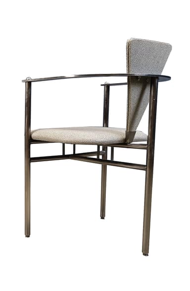 A modern armchair with a tubular metal frame and upholstered seat and backrest. The frame is constructed from polished chrome or stainless steel, featuring cylindrical legs and armrests. The seat and backrest are upholstered in a light-colored fabric with a speckled pattern. The design is minimalist and functional. — 3D model