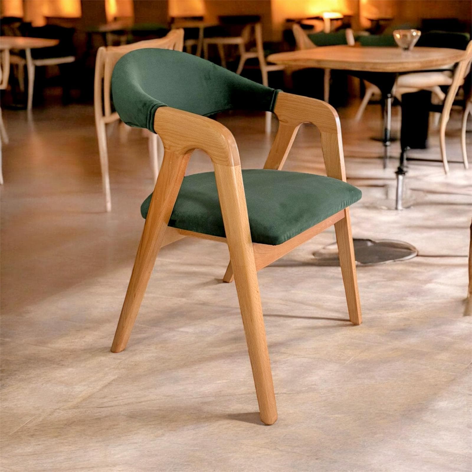 A contemporary armchair featuring a light-toned wooden frame and dark green upholstered seat and back. The design incorporates integrated wooden armrests that flow from the backrest, and four tapered wooden legs. The backrest is gently curved, providing ergonomic support. — 3D model