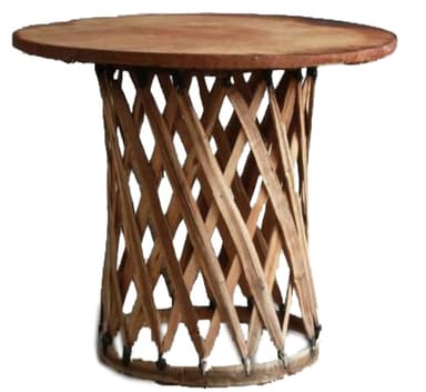 A round side table featuring a solid wood top and a distinctive woven lattice base. The base is constructed from interconnected wooden strips, creating a tapered cylindrical form, with a circular wooden rim at the bottom secured by visible binding. The entire piece has a natural, light brown wood finish, suggesting a rustic or organic aesthetic. — 3D model