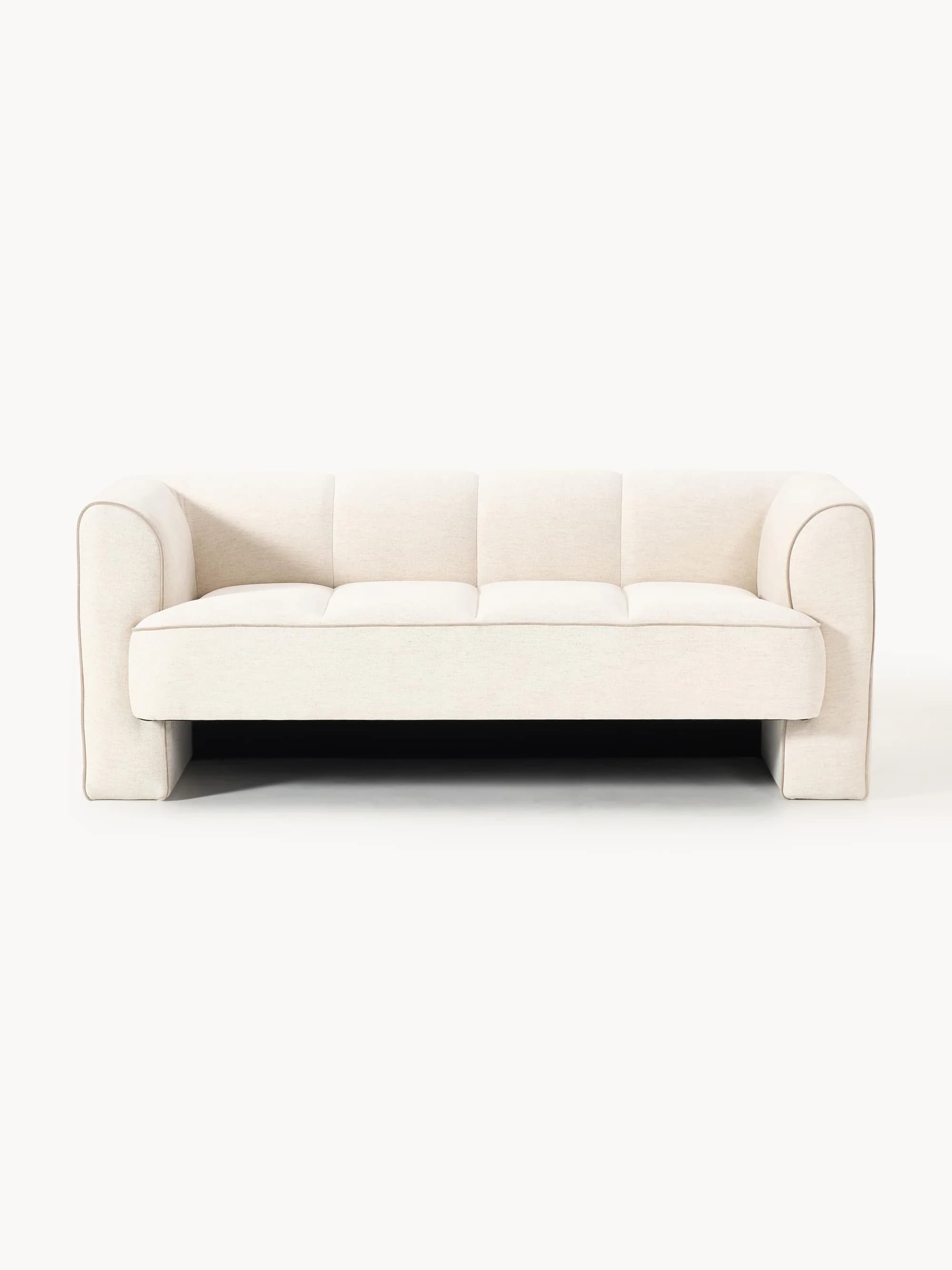A modern three-seater sofa upholstered in a light, neutral-toned fabric. It features clean, straight track arms, a structured backrest, and blind tufting on both the seat and back cushions. Subtle contrast piping highlights the edges of the sofa, and it rests on an integrated block base. — 3D model