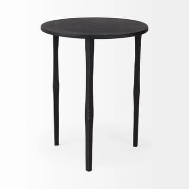 A small, round-topped side table with three legs. The table has a textured, matte black finish. The legs are slender and taper towards the bottom, with an irregular, handcrafted appearance. — 3D model