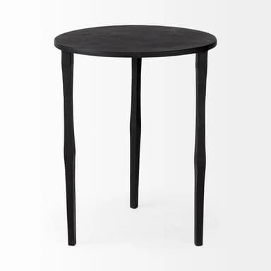 A small, round-topped side table with three legs. The table has a textured, matte black finish. The legs are slender and taper towards the bottom, with an irregular, handcrafted appearance. — 3D model