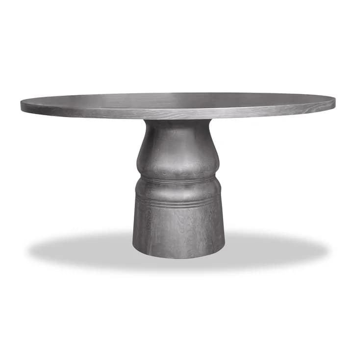 A round dining table featuring a thick, smooth circular top supported by a substantial, sculptural pedestal base. The table appears to be constructed from wood with a visible grain pattern, finished in a matte grey stain. — 3D model