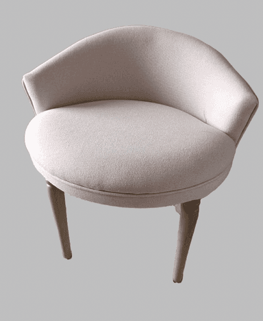 A compact, upholstered barrel-style accent chair featuring a curved backrest and integrated armrests, a rounded seat cushion, and four tapered wooden legs. The upholstery is a light, neutral-toned textured fabric. — 3D model