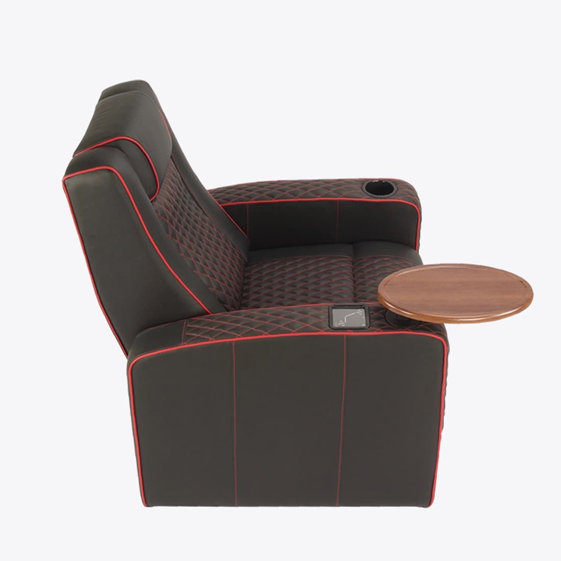 A modern black recliner chair featuring red contrast piping and diamond-patterned quilted stitching on the seat, backrest, and armrests. The chair includes an integrated cup holder in one armrest, a control panel on the side for potential power functions, and a round wooden swivel side table for convenience. — 3D model