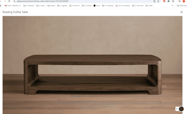 A modern low-profile media console constructed from dark wood or wood-veneered material, featuring smoothly rounded corners and edges, and a single open compartment for media storage. It has an integrated recessed base. — 3D model