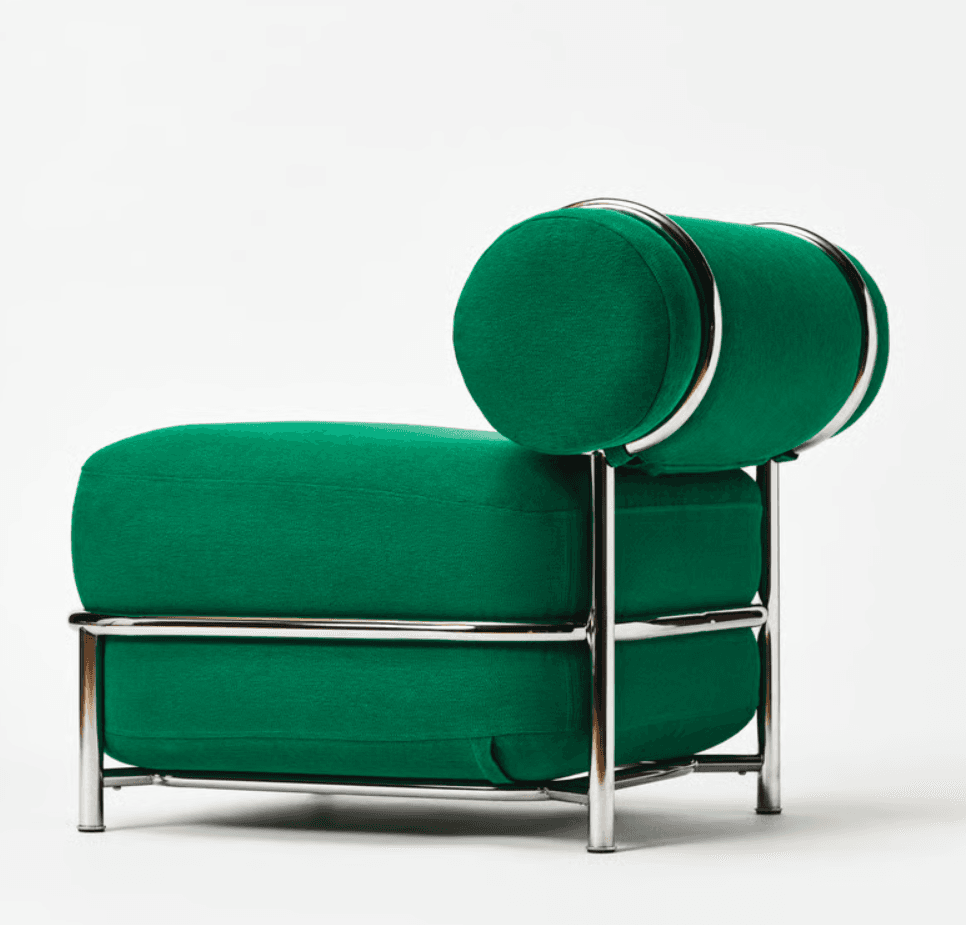 A modernist lounge chair featuring a bright emerald green upholstered seat and cylindrical bolster backrest, supported by a polished tubular chrome frame. The design is sleek and features minimalist lines. — 3D model
