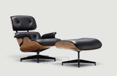 An iconic black leather and bent plywood lounge chair with a matching ottoman, characteristic of mid-century modern design. — 3D model