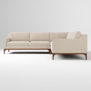 An L-shaped sectional sofa featuring light-colored fabric upholstery and an exposed dark wood base with tapered legs. The design is modern and minimalist, composed of multiple upholstered sections. — 3D model